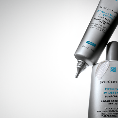 A close-up of two SkinCeuticals sunscreen tubes, one labeled "Physical Matte UV Defense" and the other "Delicate Skin UV Defense," both showcasing their products with SPF protection.
