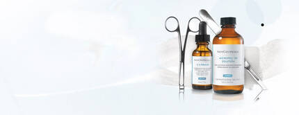 Alt text: A collection of medical tools and bottles, including a brown glass bottle labeled "Acne Solution," a smaller glass vial, and surgical instruments, set against a soft, light background.