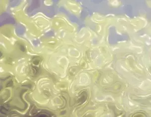 Abstract swirling patterns in soft yellow and green hues, creating a dreamy, fluid texture.