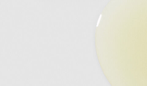 Two amber glass bottles of SkinCeuticals C E Ferulic serum, positioned against a light blue background.