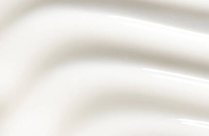 Two skincare products from SkinCeuticals are displayed against a soft, cream-colored background. The left product is a tube labeled "Retinol 0.5," and the right product is a dark glass bottle labeled "Hydrating B5."