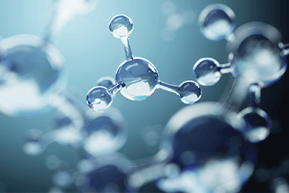 Close-up of interconnected molecular structures, showcasing transparent spheres against a soft, blurred background.